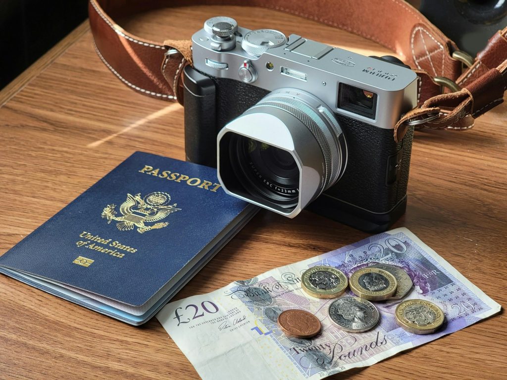 black and silver dslr camera on brown wooden table